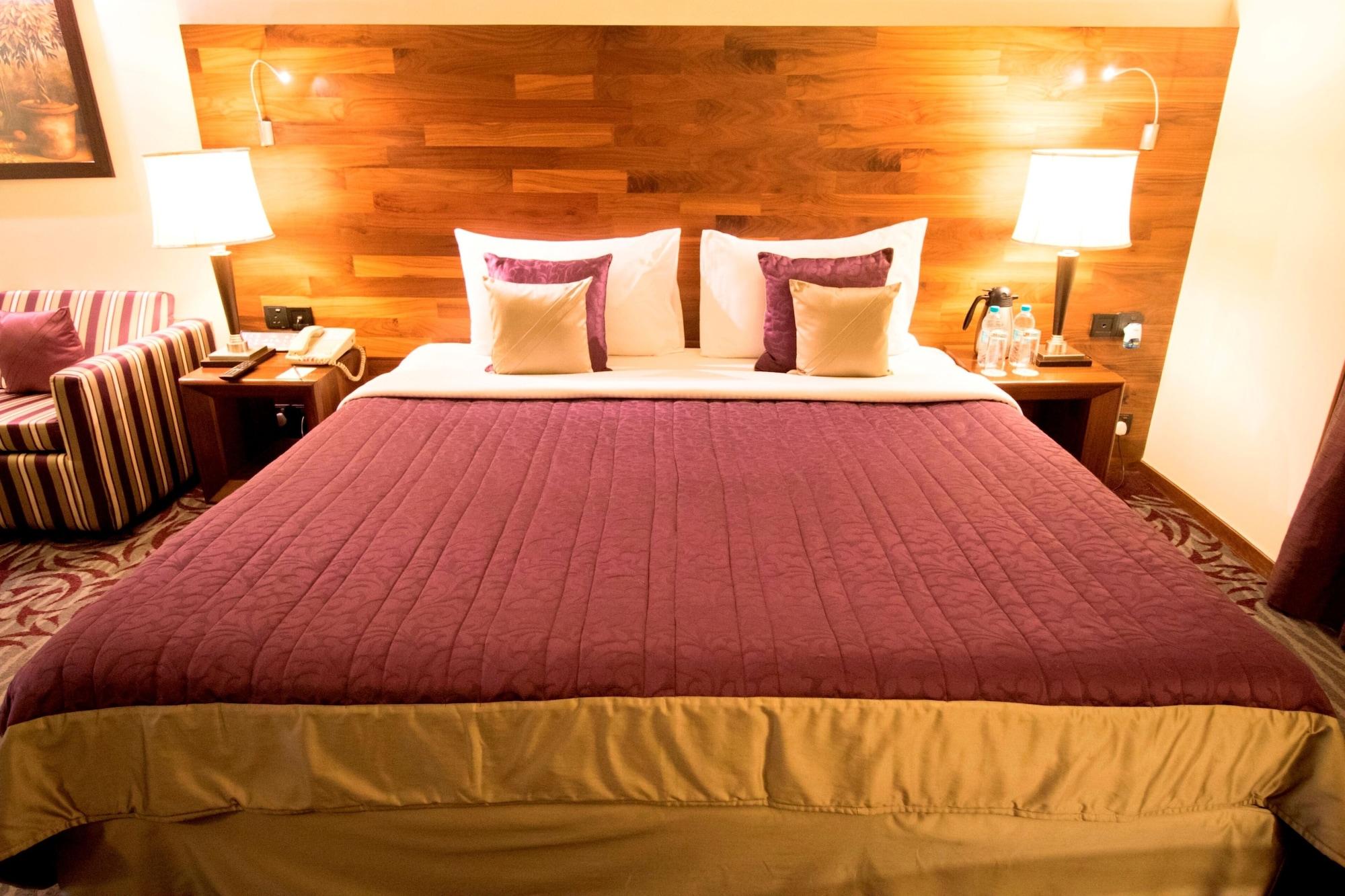 The Orchid Hotel Hinjewadi Pune Bagian luar foto A bed
