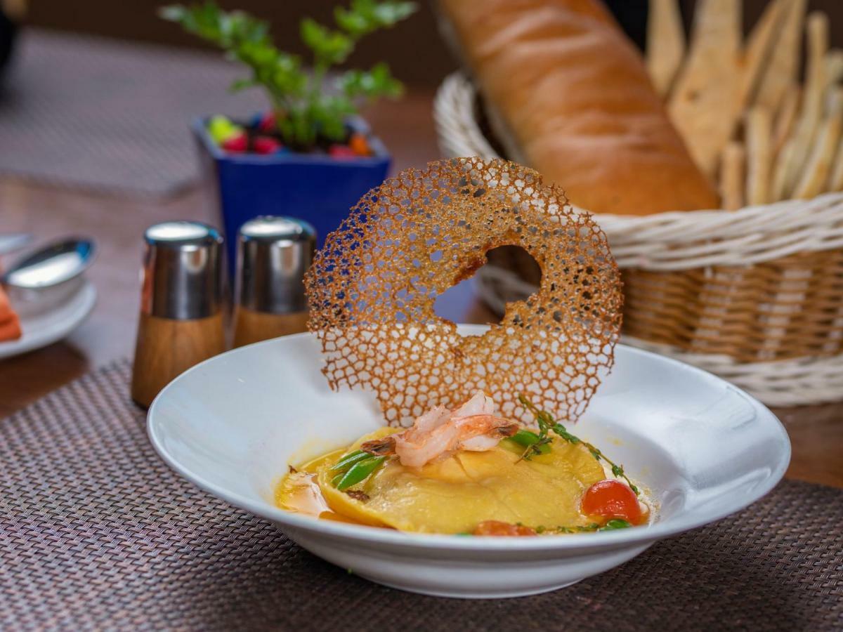 The Orchid Hotel Hinjewadi Pune Bagian luar foto A prawn and mango salad